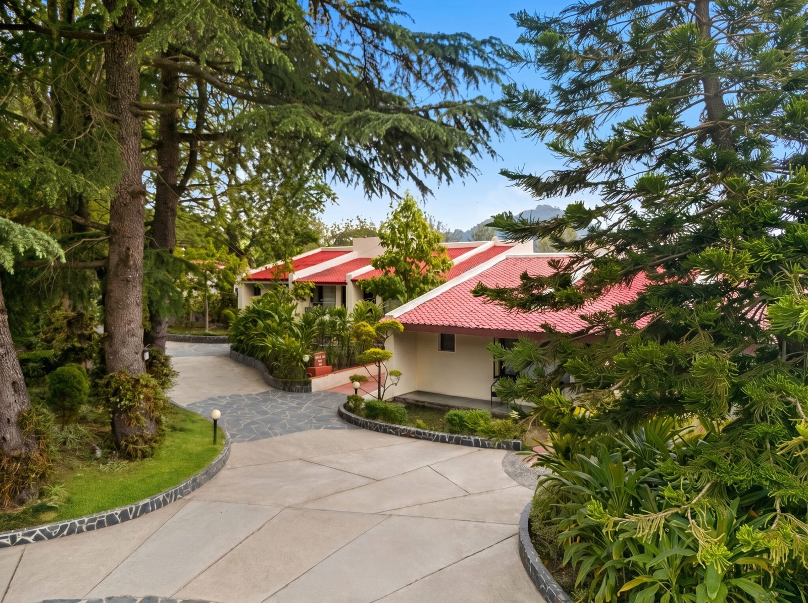 Country Inn Bhimtal sanctuary architecture surrounded by green mountain foliage